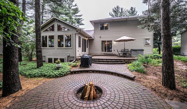 452 Spruce St, Shakopee, MN 55379 - back of property featuring a fire pit, a patio area, outdoor dining space, and a deck