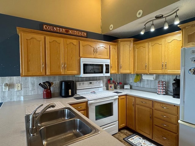 110 Glenshire Blvd S, Watkins, MN 55389 - kitchen with white appliances, light countertops, decorative backsplash, and brown cabinets