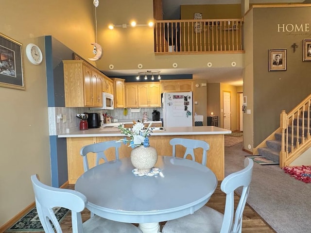 110 Glenshire Blvd S, Watkins, MN 55389 - dining room featuring stairs and a towering ceiling