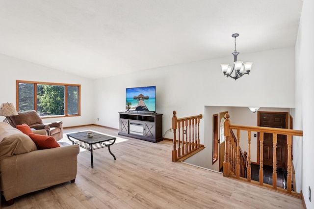 733 Meadow Dr, Hudson, WI 54016 - living room featuring a chandelier, light wood-style floors, and lofted ceiling