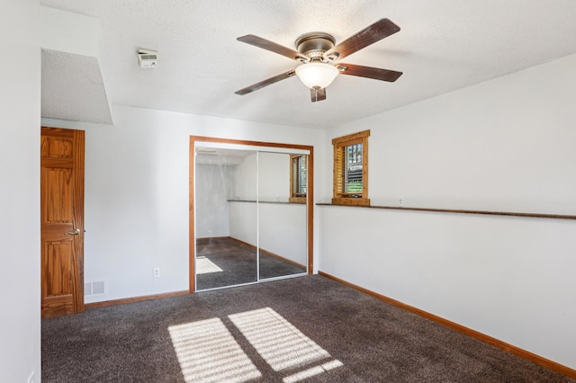 733 Meadow Dr, Hudson, WI 54016 - unfurnished bedroom with carpet floors, a closet, and a ceiling fan