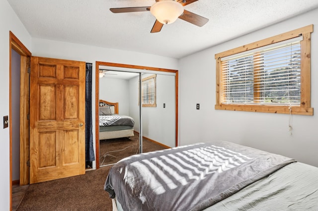 733 Meadow Dr, Hudson, WI 54016 - bedroom with dark carpet, a closet, a textured ceiling, and ceiling fan