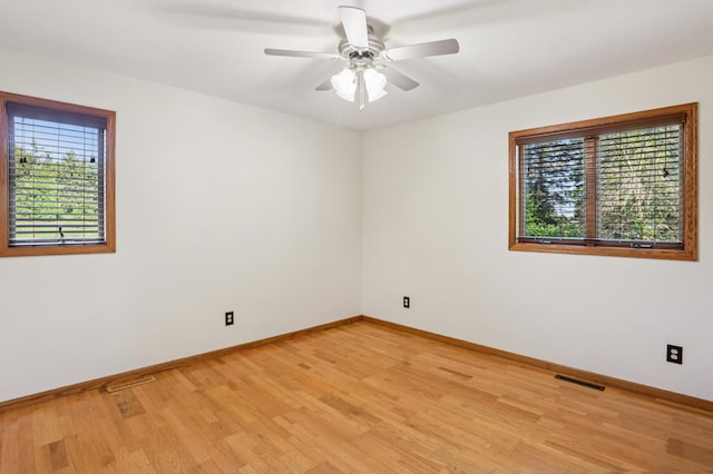 733 Meadow Dr, Hudson, WI 54016 - unfurnished room featuring light wood-style floors and a ceiling fan