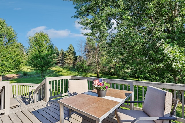 733 Meadow Dr, Hudson, WI 54016 - wooden deck with a yard and outdoor dining space