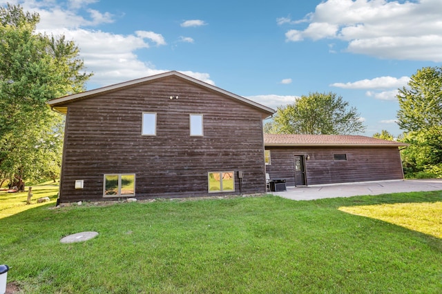733 Meadow Dr, Hudson, WI 54016 - view of side of home featuring a patio area and a yard