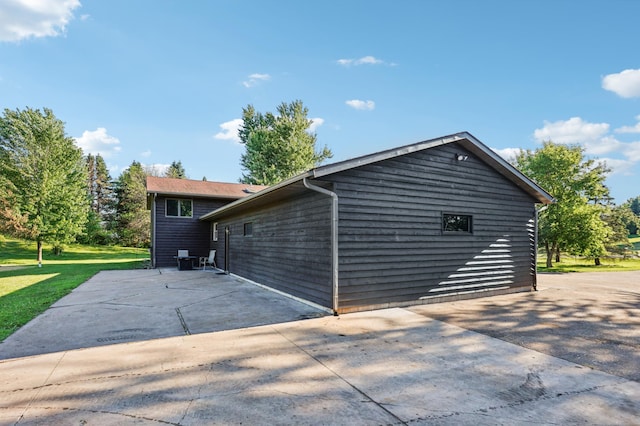 733 Meadow Dr, Hudson, WI 54016 - view of side of home with a patio area and a yard