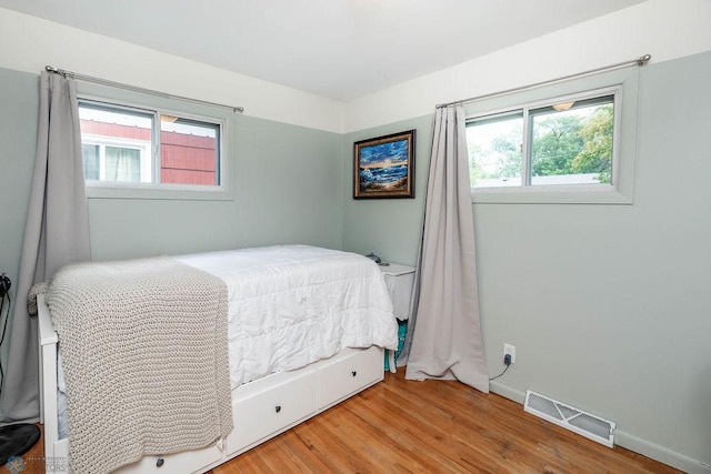 1124 15th St N, Moorhead, MN 56560 - bedroom with wood finished floors and baseboards