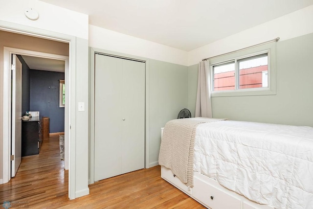 1124 15th St N, Moorhead, MN 56560 - bedroom featuring light wood finished floors and a closet