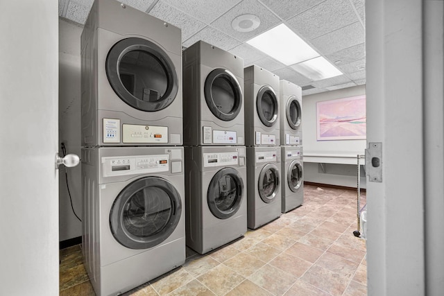 431 7th St Unit 2605, Minneapolis, MN 55415 - shared laundry featuring stacked washing machine and dryer, stone finish flooring, and washing machine and dryer