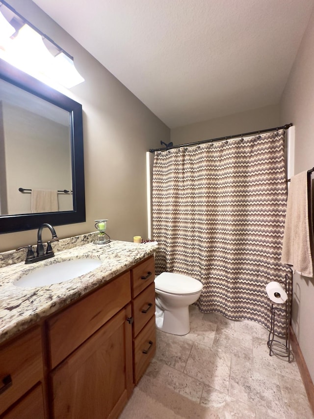 650 Shardlow Pl NE, Byron, MN 55920 - bathroom featuring vanity and stone tile flooring