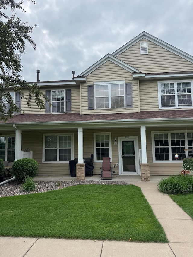 17221 Polk St NW, Elk River, MN 55330 - view of front facade featuring a porch and a front yard