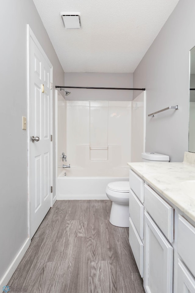 3050 18th St S, Fargo, ND 58103 - bathroom with vanity, shower / tub combination, and wood finished floors