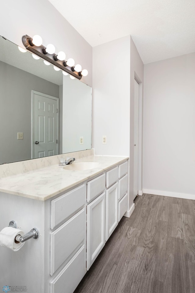 3050 18th St S, Fargo, ND 58103 - bathroom featuring wood finished floors and vanity