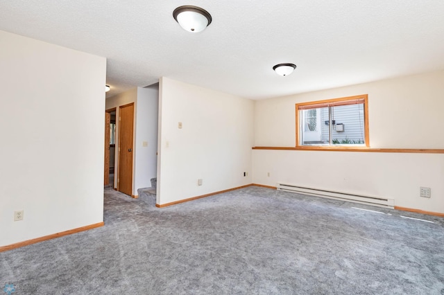 3050 18th St S, Fargo, ND 58103 - spare room featuring a baseboard heating unit and carpet