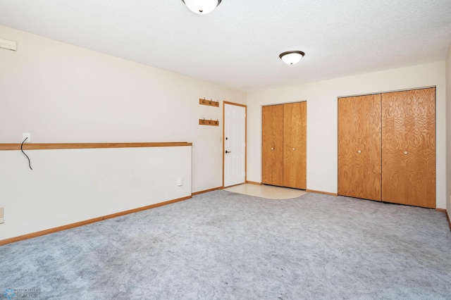 3050 18th St S, Fargo, ND 58103 - unfurnished bedroom with two closets and carpet flooring