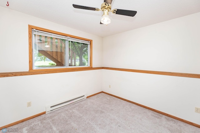 3050 18th St S, Fargo, ND 58103 - carpeted spare room with a baseboard heating unit and a ceiling fan