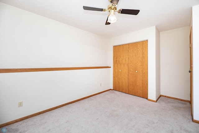 3050 18th St S, Fargo, ND 58103 - unfurnished bedroom featuring carpet, a closet, and a ceiling fan