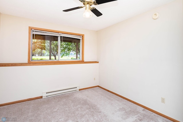 3050 18th St S, Fargo, ND 58103 - unfurnished room featuring a baseboard heating unit, carpet floors, and ceiling fan