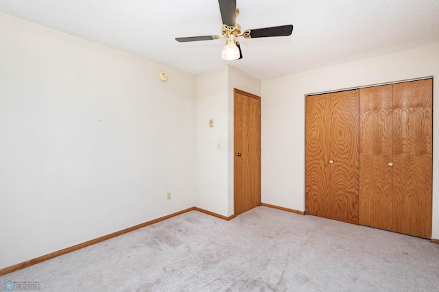 3050 18th St S, Fargo, ND 58103 - unfurnished bedroom featuring carpet flooring, a closet, and a ceiling fan