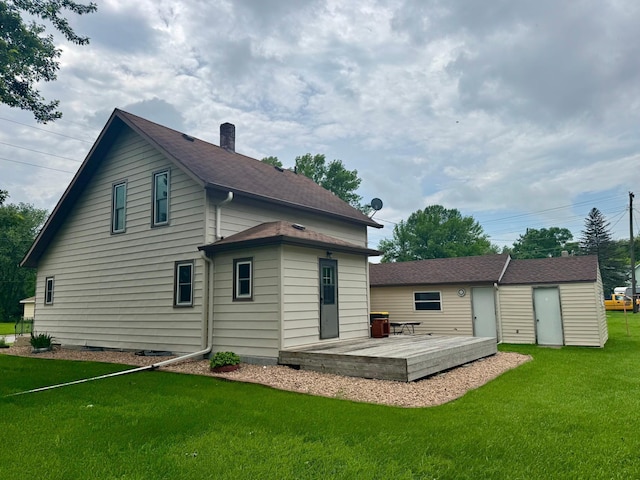720 Fir Ave, Bird Island, MN 55310 - rear view of property with a deck, a yard, and a chimney
