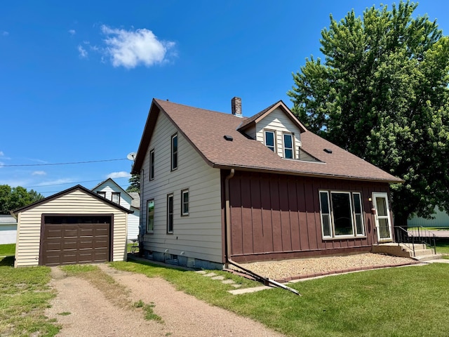 720 Fir Ave, Bird Island, MN 55310 - view of home's exterior with dirt driveway, an outdoor structure, a chimney, a garage, and roof with shingles