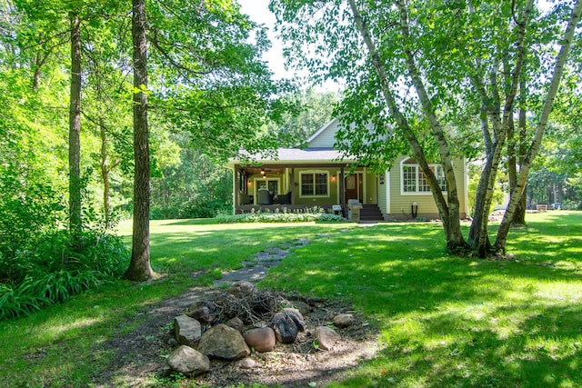 1069 134th St SW, Sylvan Twp, MN 56473 - view of front facade featuring covered porch and a front yard