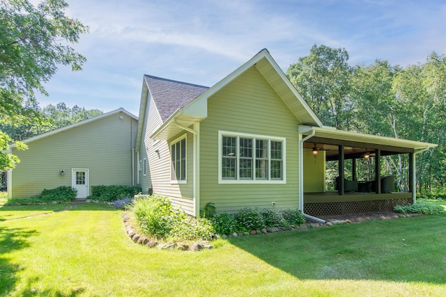 1069 134th St SW, Sylvan Twp, MN 56473 - view of side of property featuring a lawn, ceiling fan, and covered porch