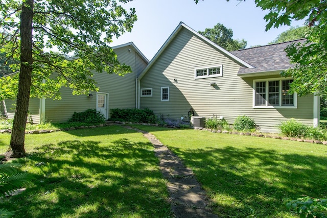 1069 134th St SW, Sylvan Twp, MN 56473 - rear view of property featuring a lawn and roof with shingles