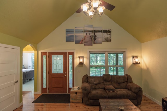 1069 134th St SW, Sylvan Twp, MN 56473 - living area featuring ceiling fan, arched walkways, light wood finished floors, and high vaulted ceiling