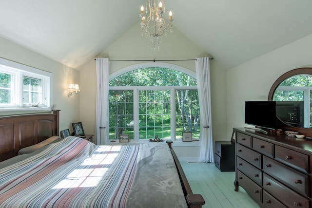 1069 134th St SW, Sylvan Twp, MN 56473 - bedroom featuring vaulted ceiling, a chandelier, multiple windows, and light wood-style flooring