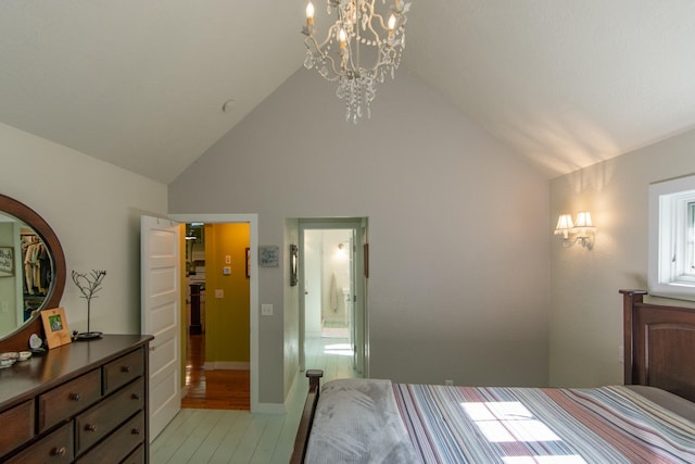 1069 134th St SW, Sylvan Twp, MN 56473 - bedroom with high vaulted ceiling, a chandelier, light wood-style floors, and ensuite bath
