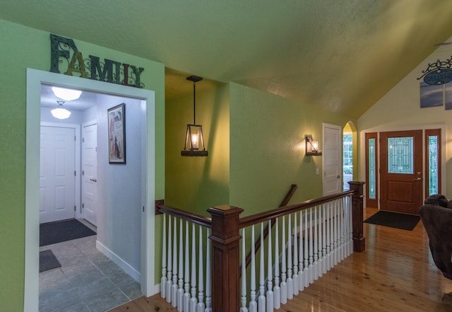 1069 134th St SW, Sylvan Twp, MN 56473 - entryway with lofted ceiling, arched walkways, and wood finished floors