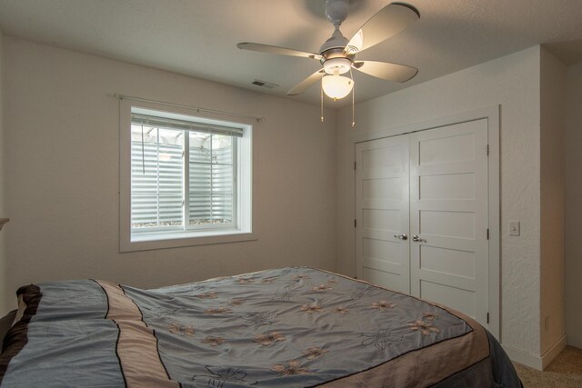1069 134th St SW, Sylvan Twp, MN 56473 - carpeted bedroom with a closet and ceiling fan