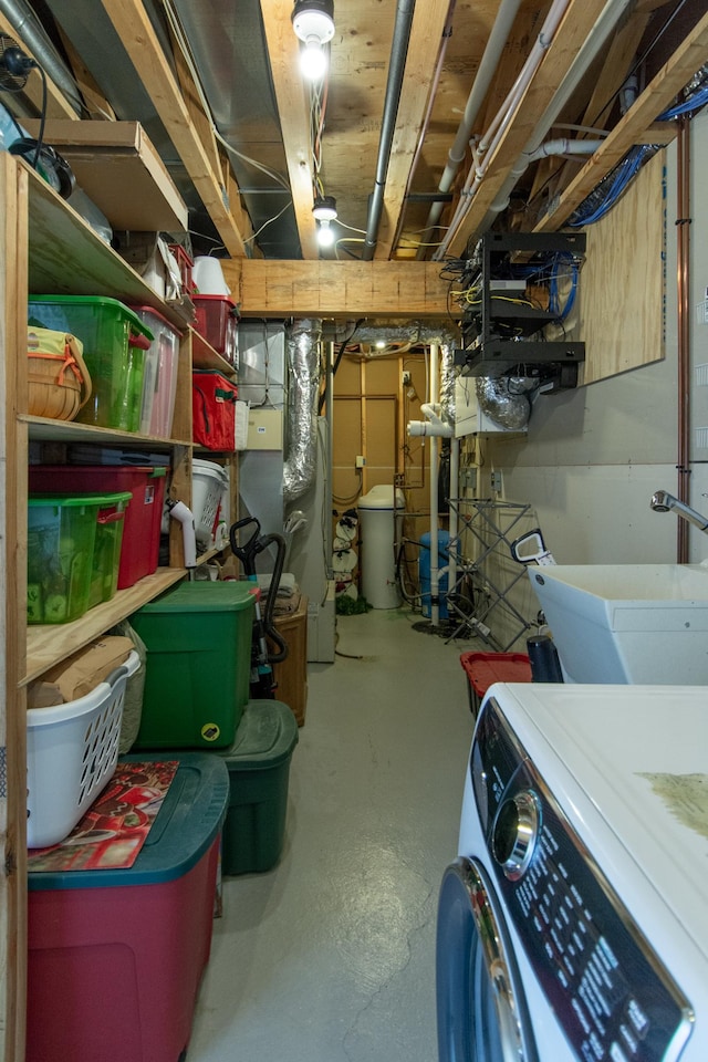 1069 134th St SW, Sylvan Twp, MN 56473 - storage room featuring washer / dryer and heating unit