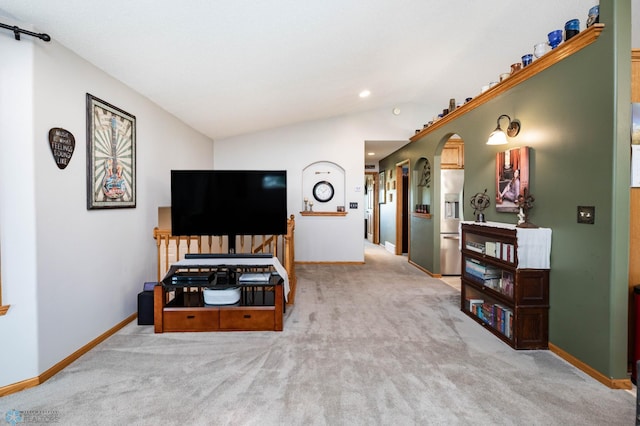 106 12th St NE, Barnesville, MN 56514 - living room featuring vaulted ceiling, carpet flooring, arched walkways, and recessed lighting