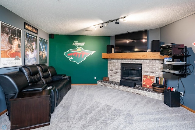 106 12th St NE, Barnesville, MN 56514 - living area with carpet, a textured ceiling, a brick fireplace, and track lighting