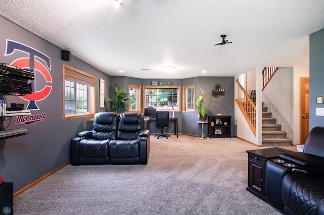 106 12th St NE, Barnesville, MN 56514 - carpeted living room featuring stairs and a textured ceiling