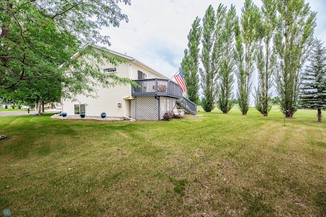 106 12th St NE, Barnesville, MN 56514 - view of grassy yard with a wooden deck and stairs