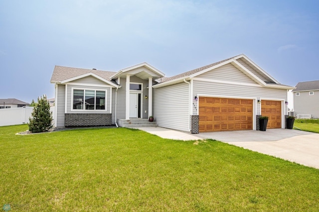 4701 11th St W, West Fargo, ND 58078 - view of front facade featuring an attached garage, driveway, and brick siding