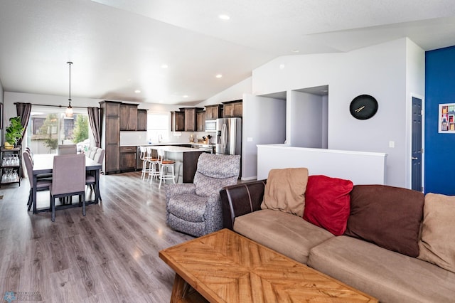 4701 11th St W, West Fargo, ND 58078 - living area with lofted ceiling, wood finished floors, and recessed lighting