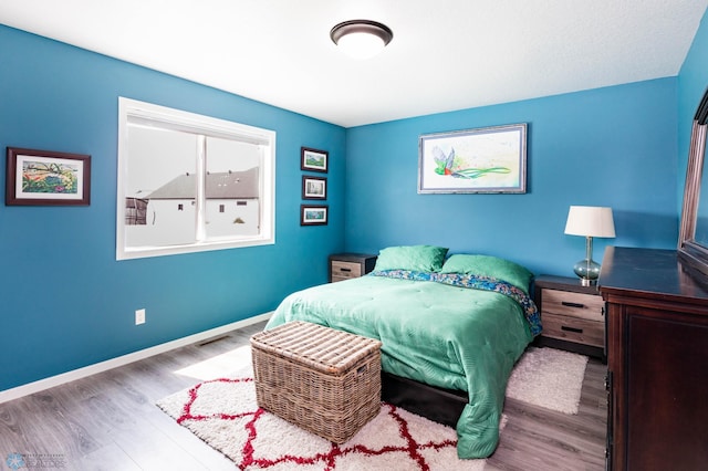 4701 11th St W, West Fargo, ND 58078 - bedroom featuring wood finished floors and baseboards