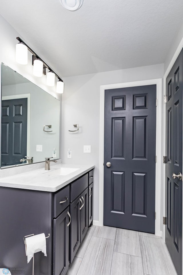 4701 11th St W, West Fargo, ND 58078 - bathroom featuring vanity and baseboards