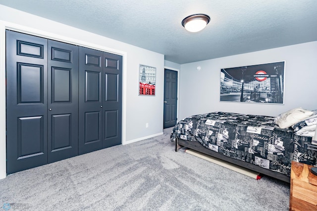 4701 11th St W, West Fargo, ND 58078 - carpeted bedroom featuring a textured ceiling and a closet