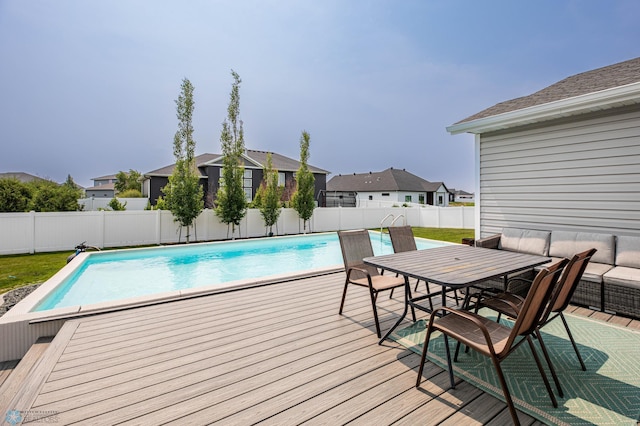 4701 11th St W, West Fargo, ND 58078 - view of pool featuring a fenced backyard, a deck, and a residential view