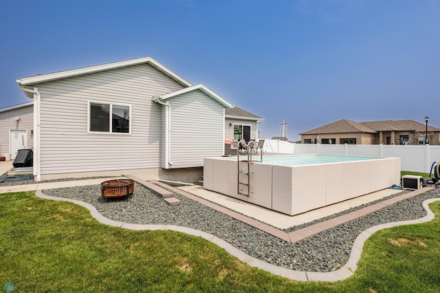 4701 11th St W, West Fargo, ND 58078 - rear view of property featuring an outdoor fire pit and a patio area