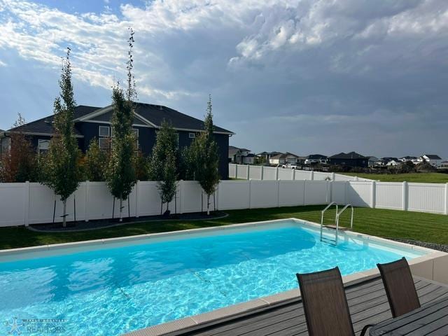 4701 11th St W, West Fargo, ND 58078 - view of pool featuring a fenced backyard and a residential view