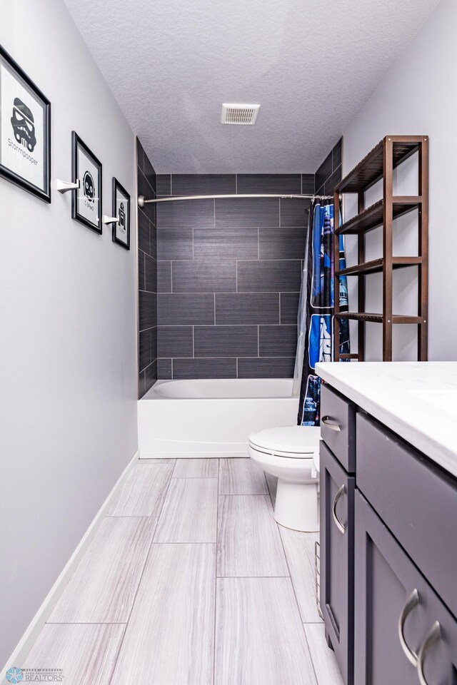 4701 11th St W, West Fargo, ND 58078 - full bathroom with vanity, shower / bath combination with curtain, and a textured ceiling