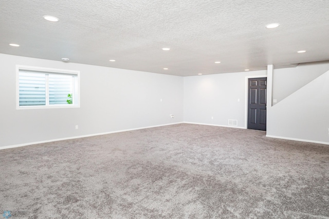 4701 11th St W, West Fargo, ND 58078 - carpeted empty room with a textured ceiling and recessed lighting