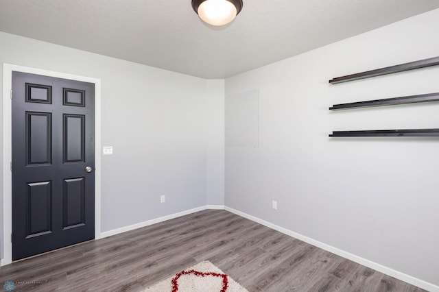 4701 11th St W, West Fargo, ND 58078 - spare room with wood finished floors and baseboards