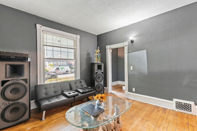 3114 Russell Ave N, Minneapolis, MN 55411 - living room with wood-type flooring and a textured ceiling